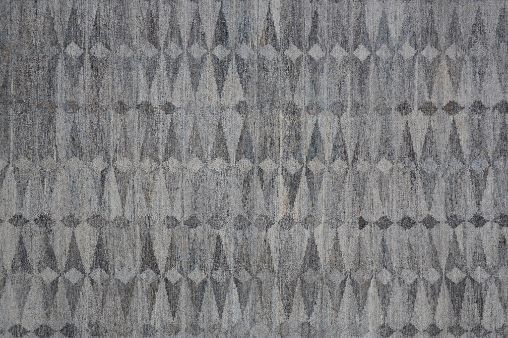 4' X 6' Gray Silver And Ivory Geometric Hand Woven Stain Resistant Area Rug With Fringe