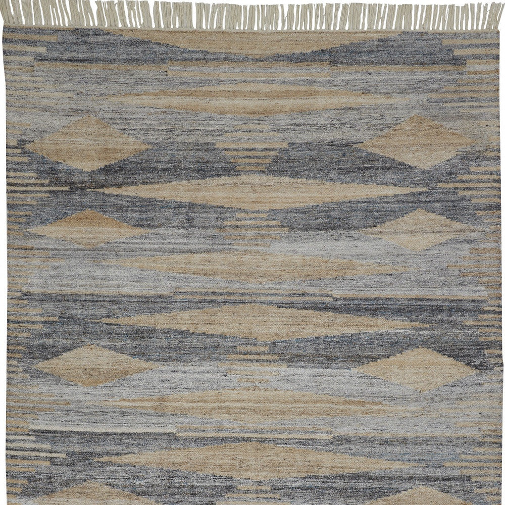 5' X 8' Gray Tan And Silver Abstract Hand Woven Stain Resistant Area Rug With Fringe