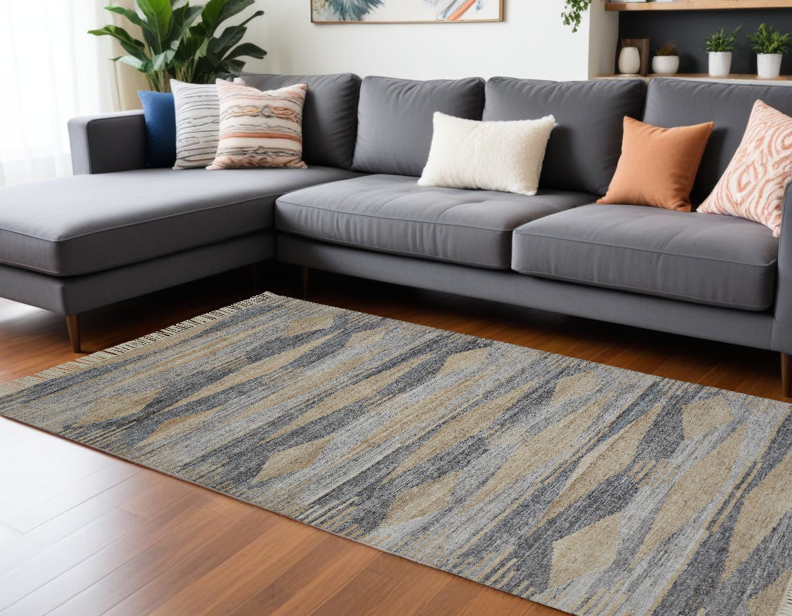 5' X 8' Gray Tan And Silver Abstract Hand Woven Stain Resistant Area Rug With Fringe