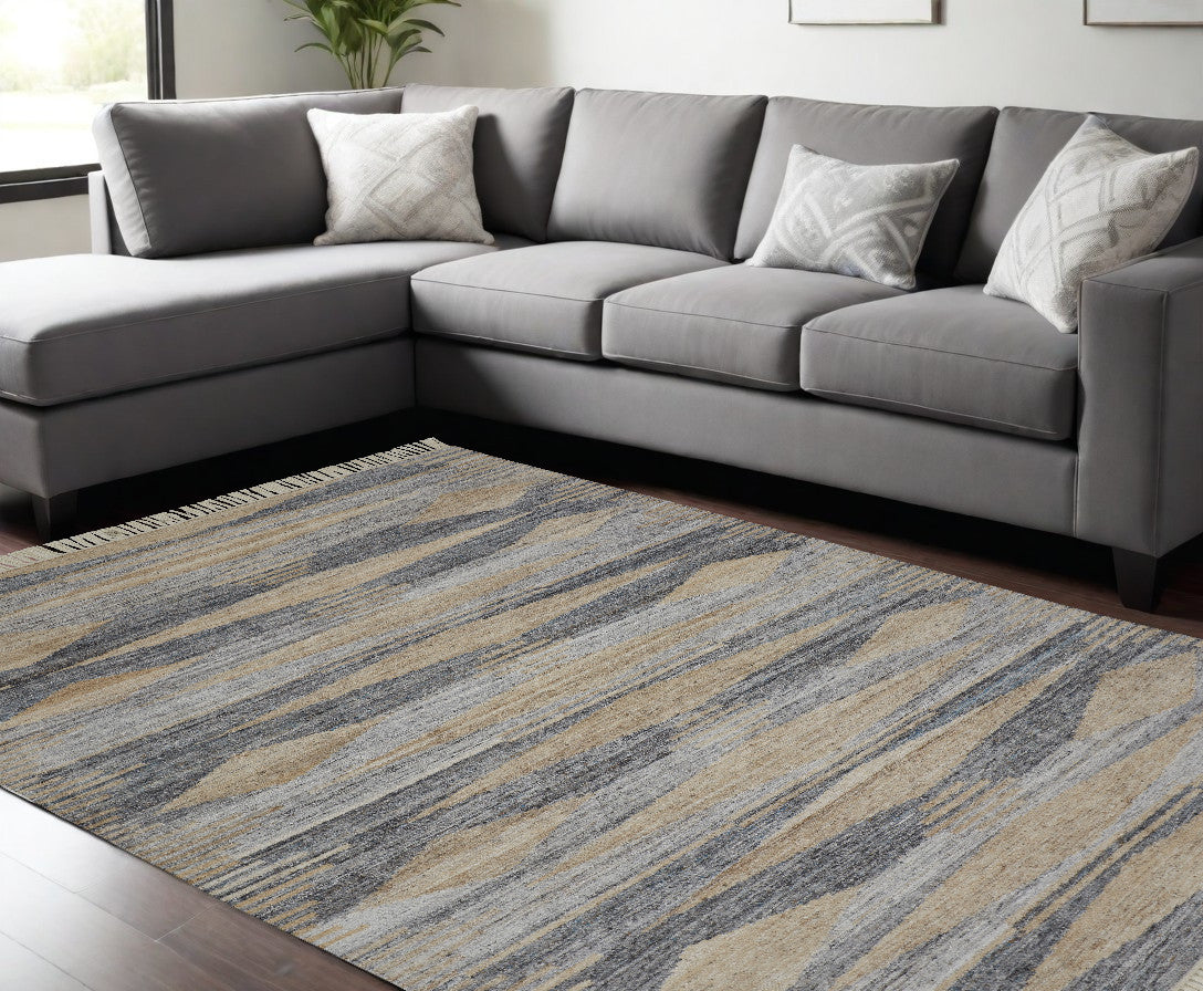 5' X 8' Gray Tan And Silver Abstract Hand Woven Stain Resistant Area Rug With Fringe