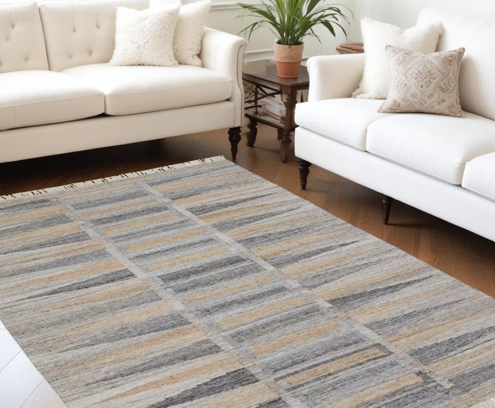 5' X 8' Gray Black And Brown Geometric Hand Woven Area Rug With Fringe