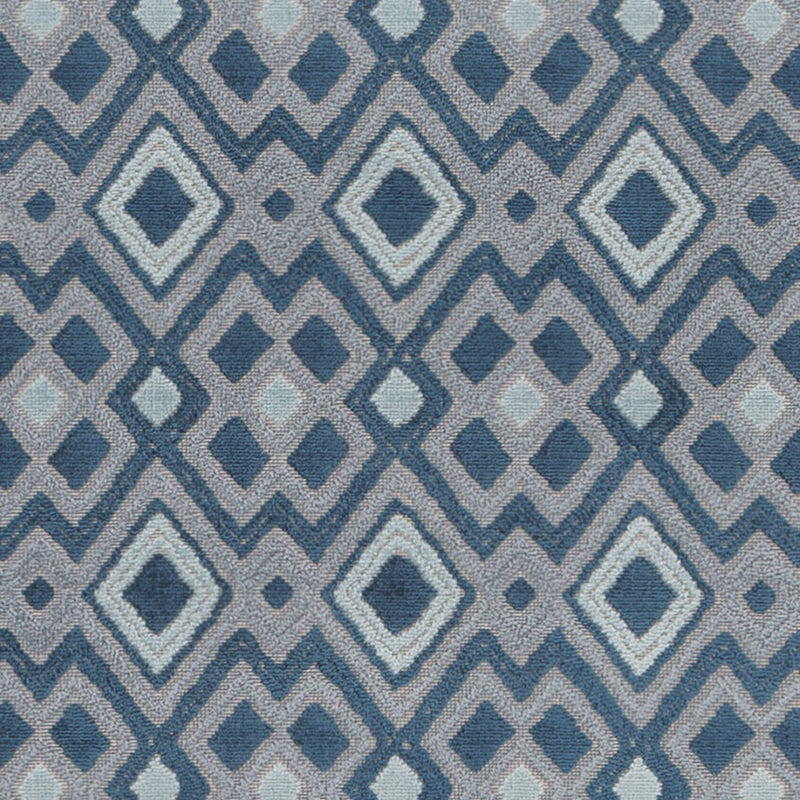 Blue geometric diamond lattice pattern on textured upholstery fabric with navy, mid-blue, and light-blue diamonds