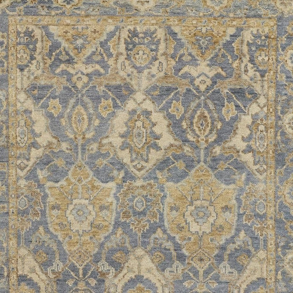 5' X 8' Blue Gold And Tan Wool Floral Hand Knotted Stain Resistant Area Rug With Fringe