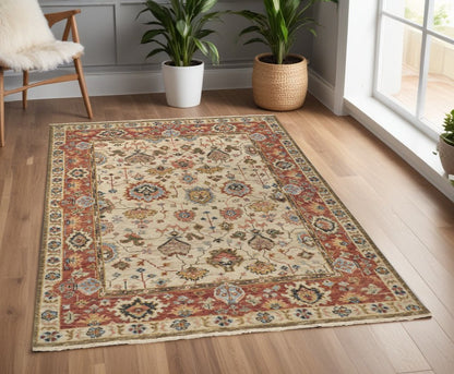 5' X 8' Ivory Red And Blue Wool Floral Hand Knotted Stain Resistant Area Rug