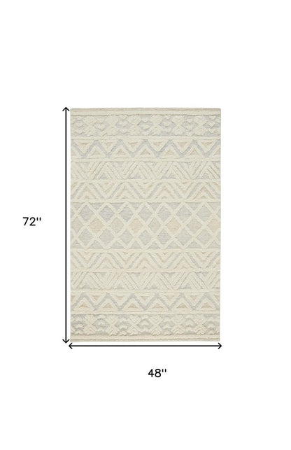 4' X 6' Ivory Blue And Tan Wool Geometric Tufted Handmade Stain Resistant Area Rug