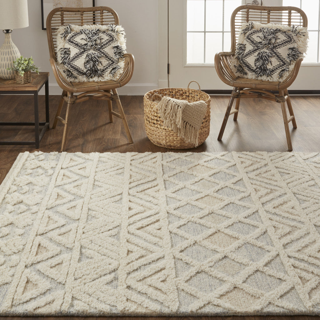 5' X 8' Ivory Blue And Tan Wool Geometric Tufted Handmade Stain Resistant Area Rug