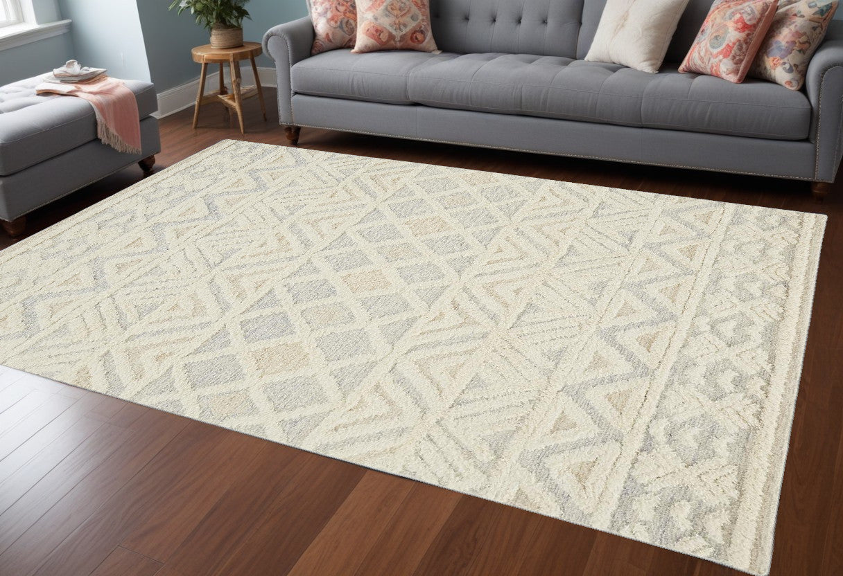 5' X 8' Ivory Blue And Tan Wool Geometric Tufted Handmade Stain Resistant Area Rug