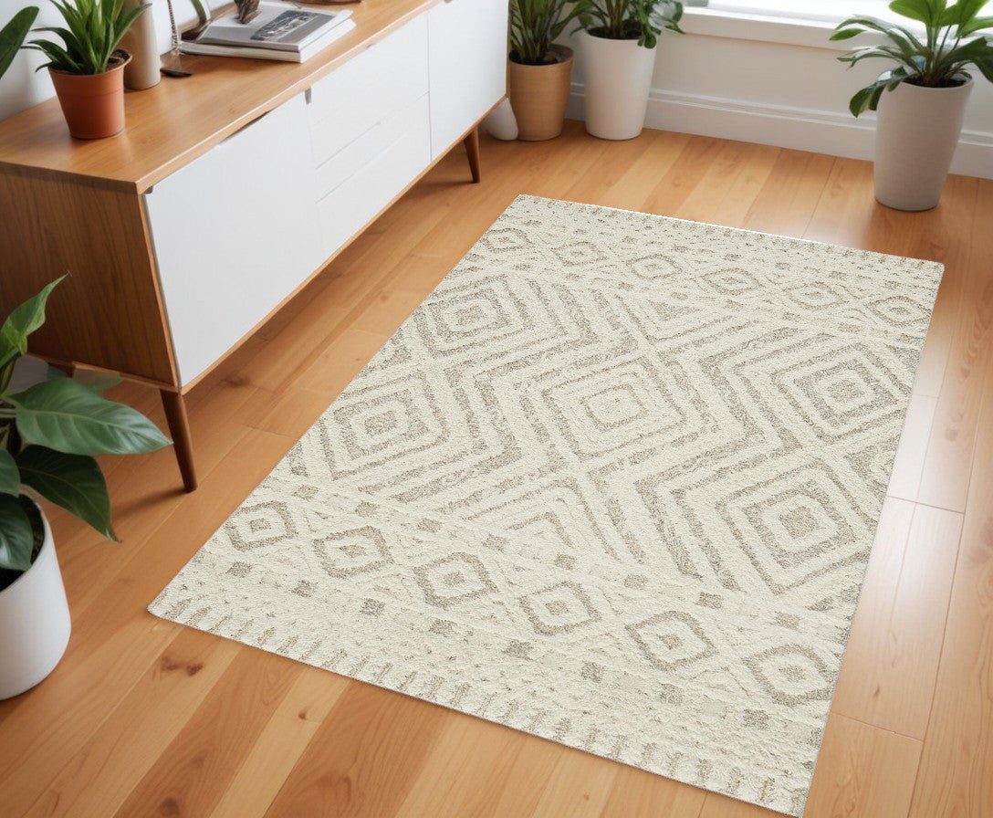 8' X 10' Ivory And Tan Wool Geometric Tufted Handmade Stain Resistant Area Rug