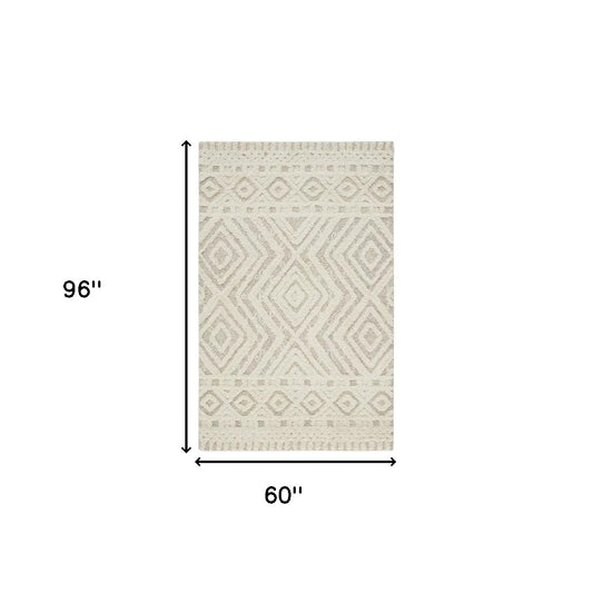 9' X 12' Ivory And Tan Wool Geometric Tufted Handmade Stain Resistant Area Rug