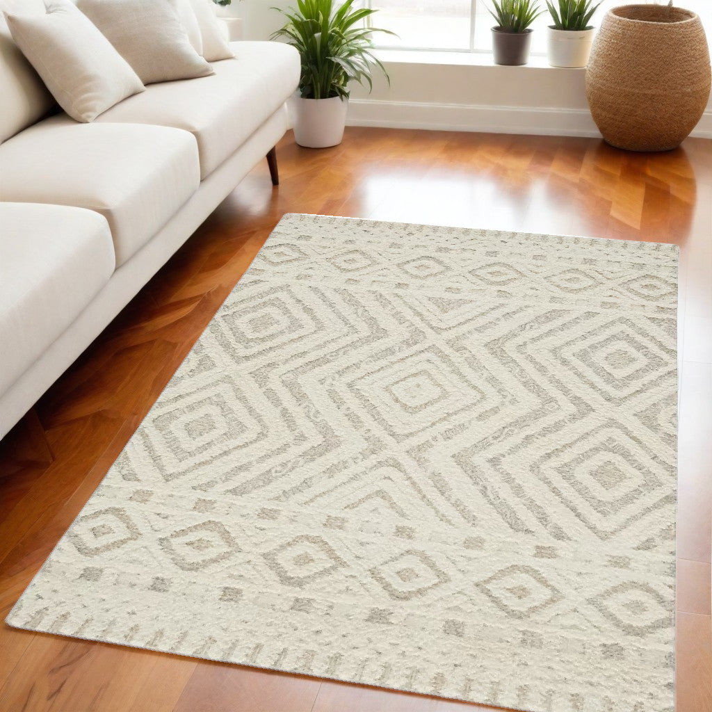 8' X 10' Ivory And Tan Wool Geometric Tufted Handmade Stain Resistant Area Rug