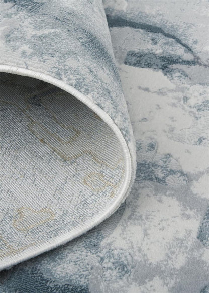 5' X 8' Blue Gray And Ivory Abstract Distressed Stain Resistant Area Rug