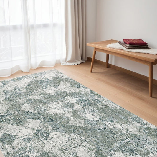 5' X 8' Green And Ivory Patchwork Distressed Stain Resistant Area Rug