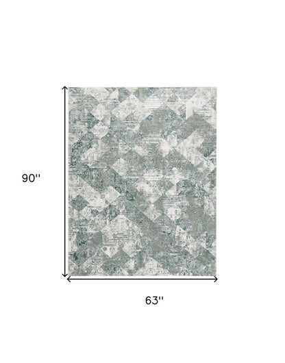 5' X 8' Green And Ivory Patchwork Distressed Stain Resistant Area Rug