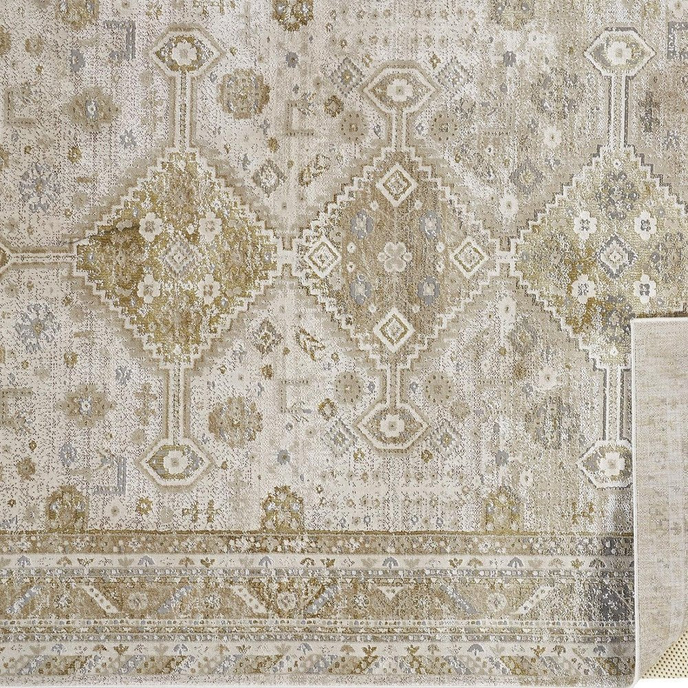 7' X 10' Gold And Ivory Floral Stain Resistant Area Rug