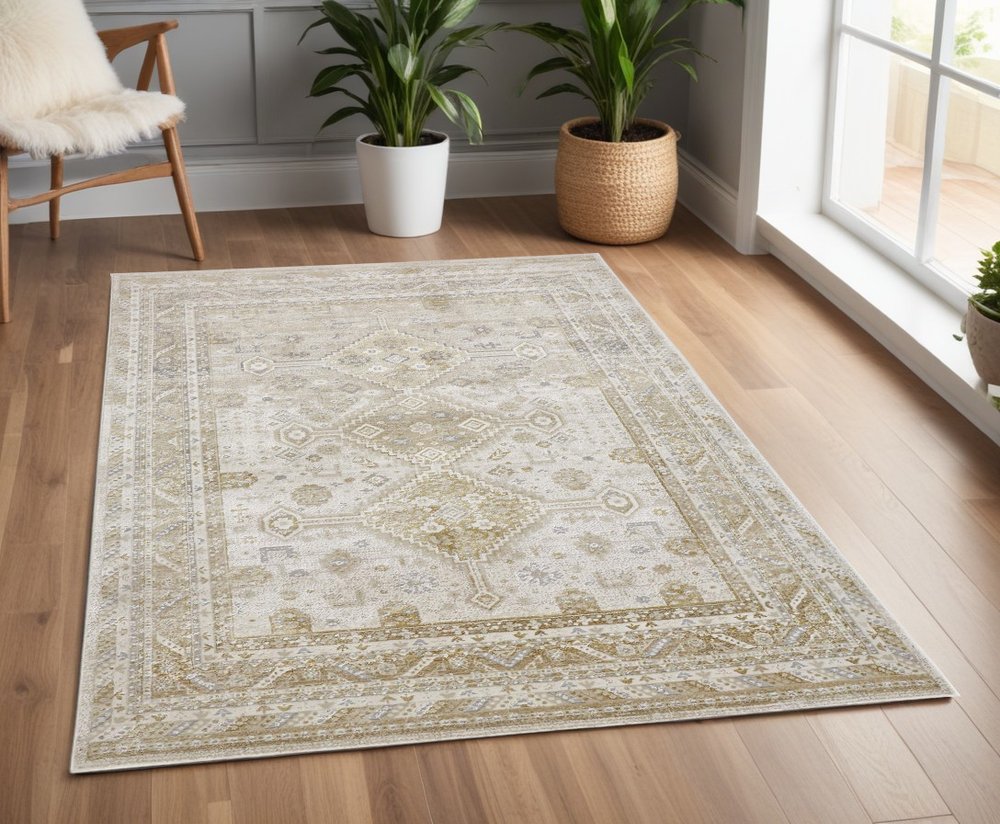 7' X 10' Gold And Ivory Floral Stain Resistant Area Rug