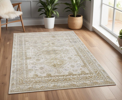 7' X 10' Gold And Ivory Floral Stain Resistant Area Rug