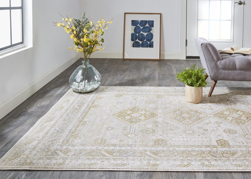 7' X 10' Gold And Ivory Floral Stain Resistant Area Rug