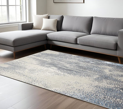 4' X 6' Ivory Gray And Blue Abstract Area Rug