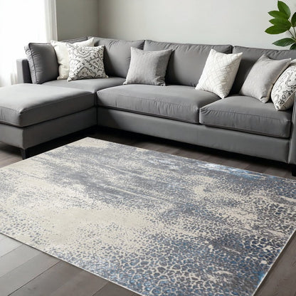 4' X 6' Ivory Gray And Blue Abstract Area Rug