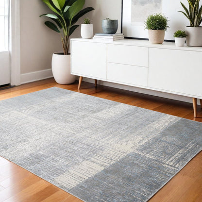 5' X 8' Blue And Gray Abstract Area Rug
