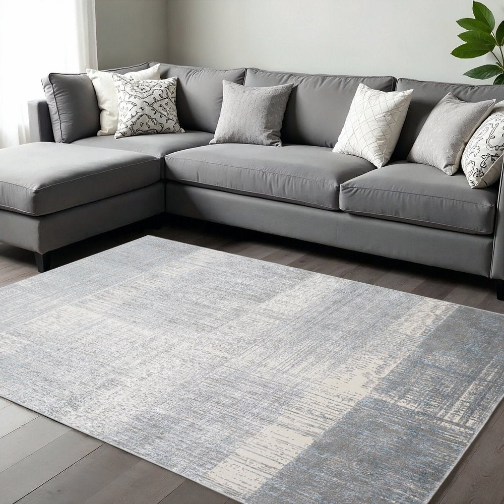 5' X 8' Blue And Gray Abstract Area Rug