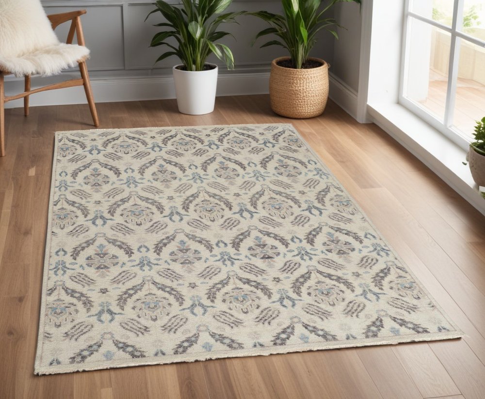 8' X 10' Ivory Gray And Blue Wool Floral Hand Knotted Stain Resistant Area Rug