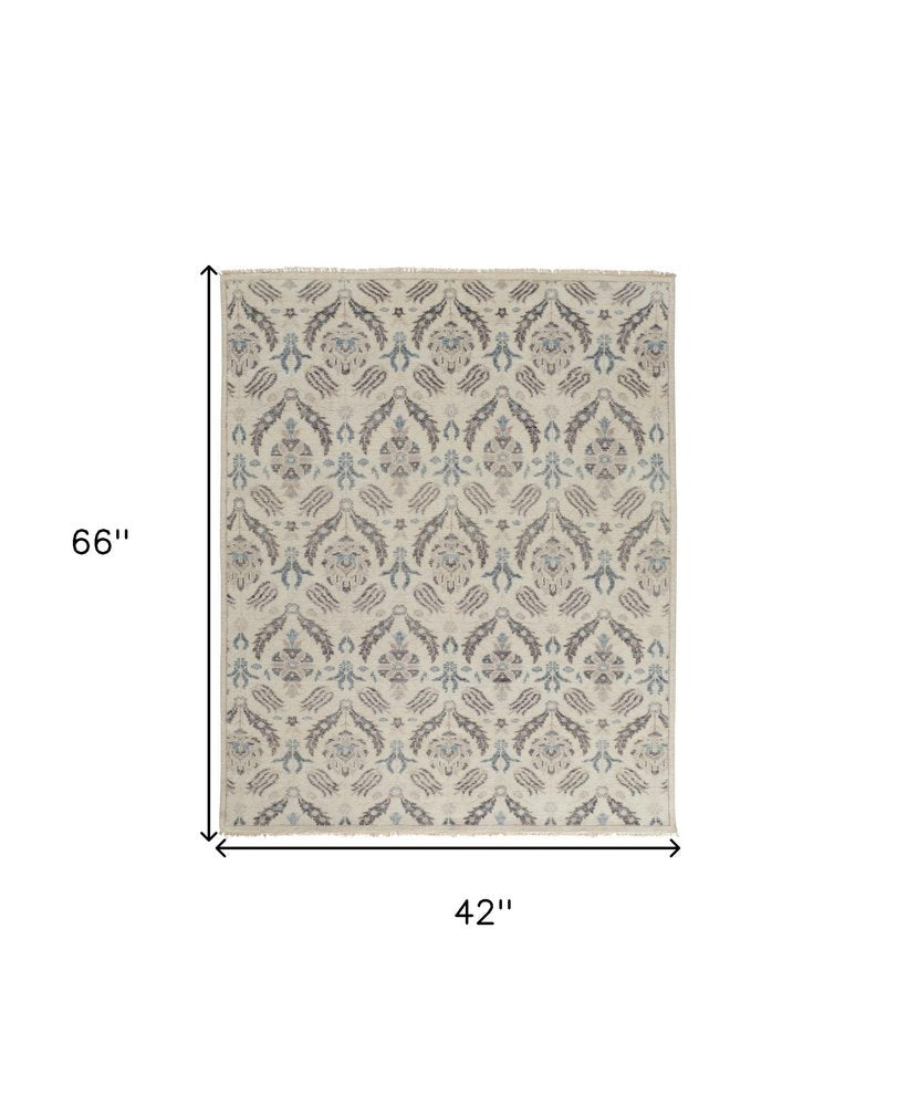 8' X 10' Ivory Gray And Blue Wool Floral Hand Knotted Stain Resistant Area Rug