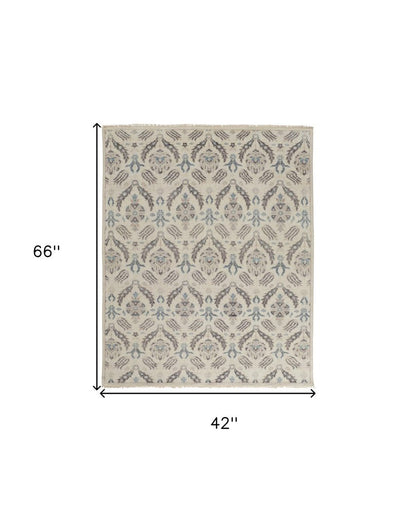 8' X 10' Ivory Gray And Blue Wool Floral Hand Knotted Stain Resistant Area Rug