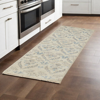 8' X 10' Ivory Gray And Blue Wool Floral Hand Knotted Stain Resistant Area Rug