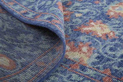5' X 8' Blue And Red Wool Floral Hand Knotted Stain Resistant Area Rug