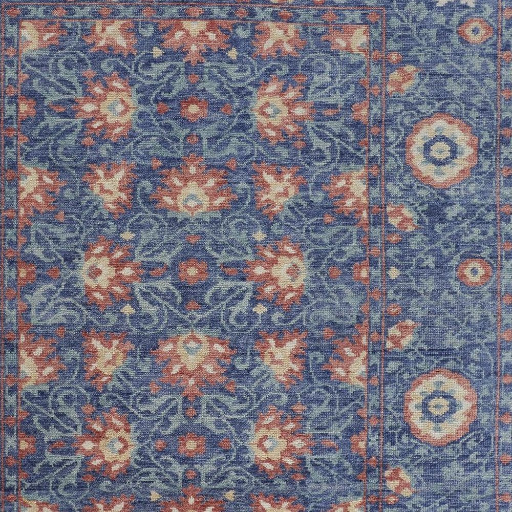 5' X 8' Blue And Red Wool Floral Hand Knotted Stain Resistant Area Rug