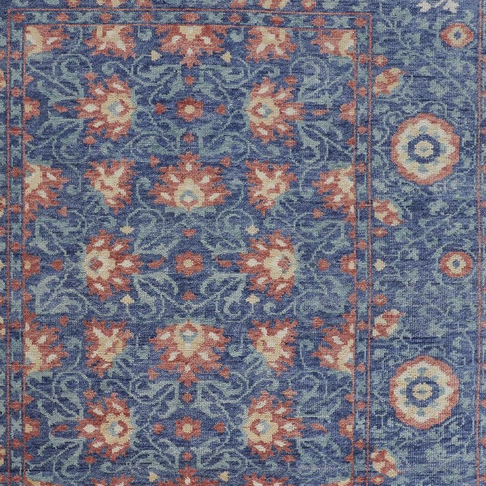 5' X 8' Blue And Red Wool Floral Hand Knotted Stain Resistant Area Rug