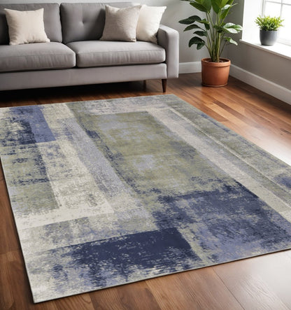 4' X 6' Blue Green And Ivory Abstract Distressed Area Rug