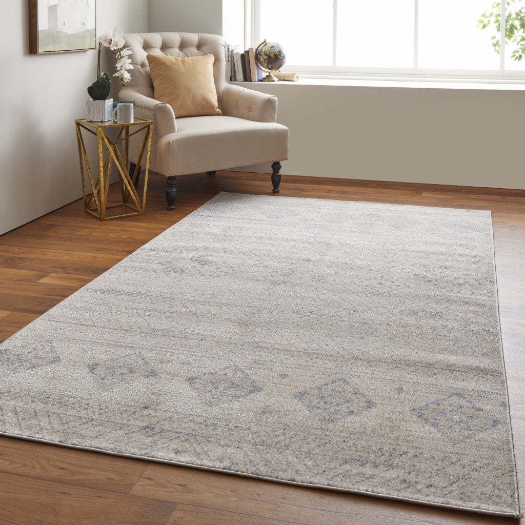 4' X 6' Ivory And Blue Geometric Power Loom Distressed Area Rug