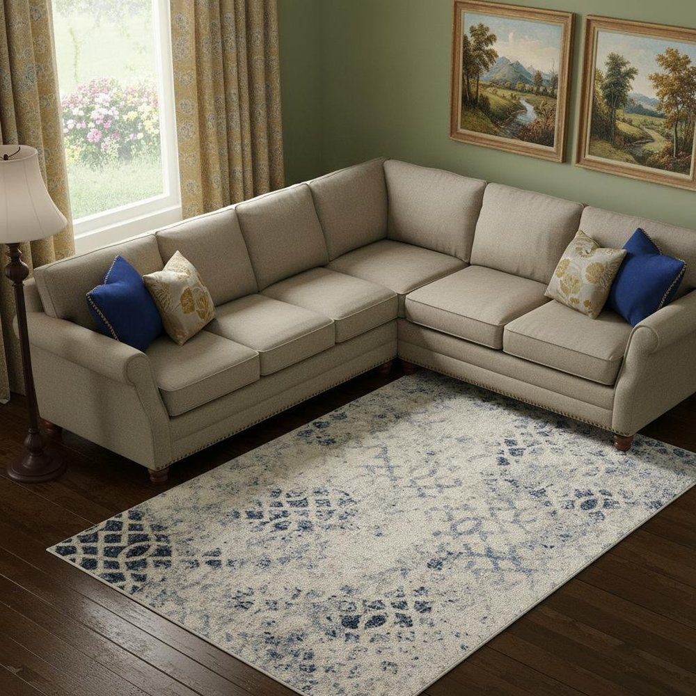 7' X 10' Ivory And Blue Abstract Power Loom Distressed Area Rug