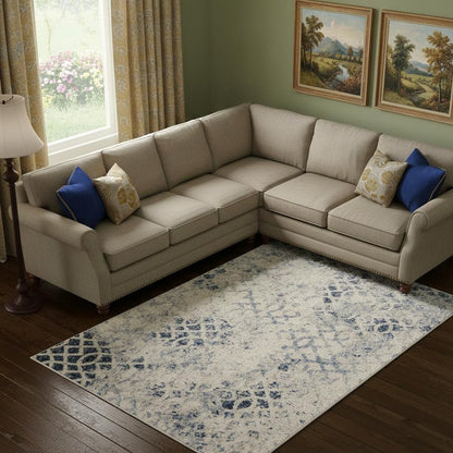 7' X 10' Ivory And Blue Abstract Power Loom Distressed Area Rug
