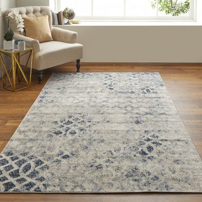 7' X 10' Ivory And Blue Abstract Power Loom Distressed Area Rug