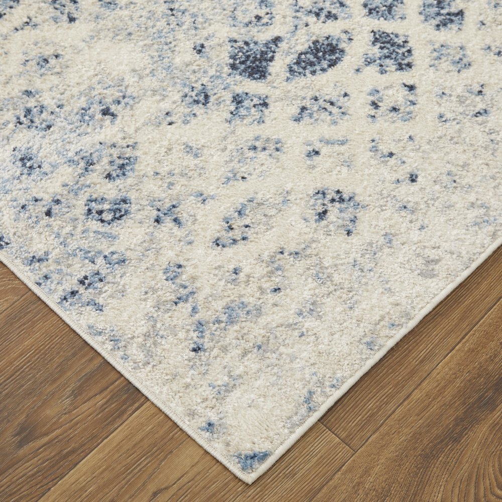 7' X 10' Ivory And Blue Abstract Power Loom Distressed Area Rug