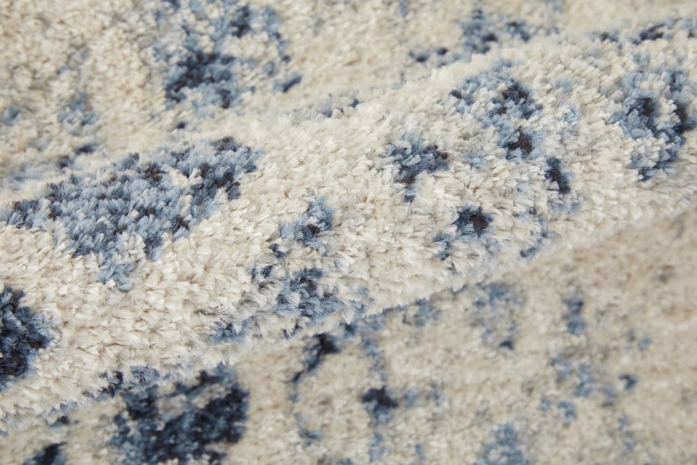 7' X 10' Ivory And Blue Abstract Power Loom Distressed Area Rug