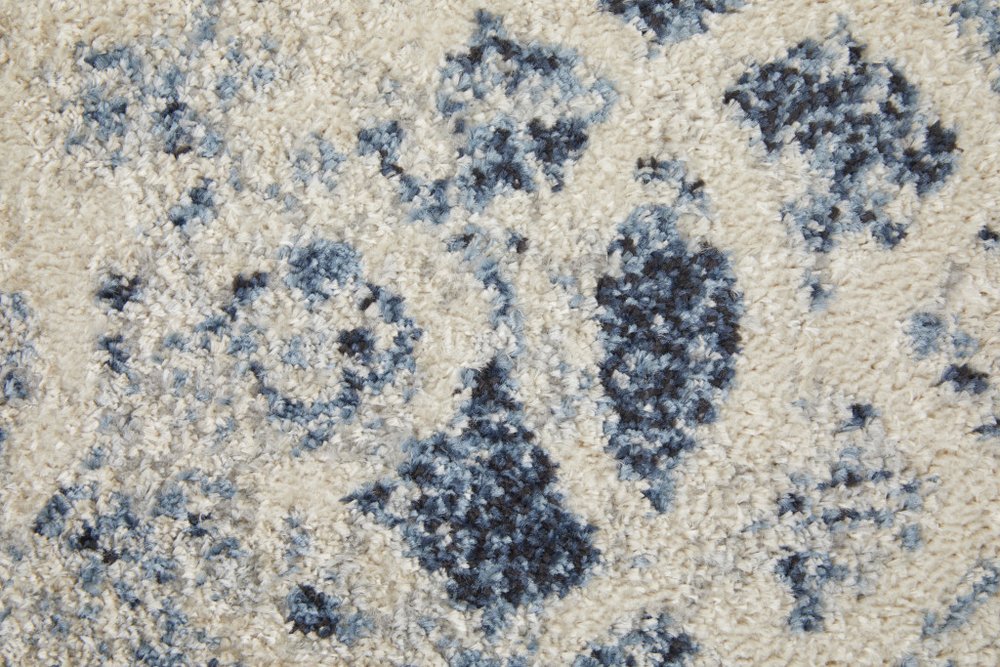 7' X 10' Ivory And Blue Abstract Power Loom Distressed Area Rug