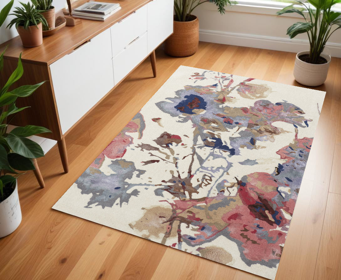 8' X 10' Ivory and Blue Wool Floral Hand Tufted Area Rug