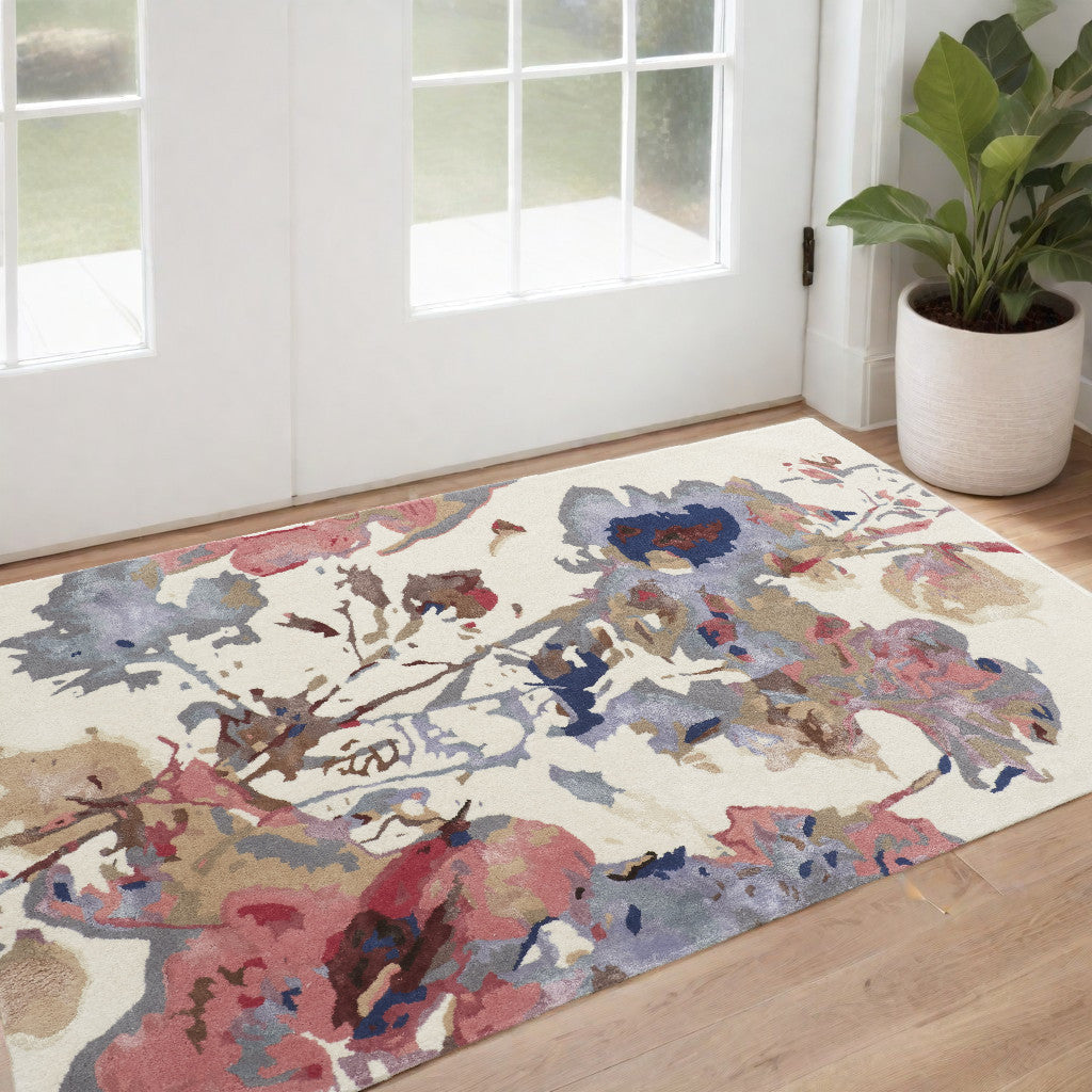 8' X 10' Ivory and Blue Wool Floral Hand Tufted Area Rug