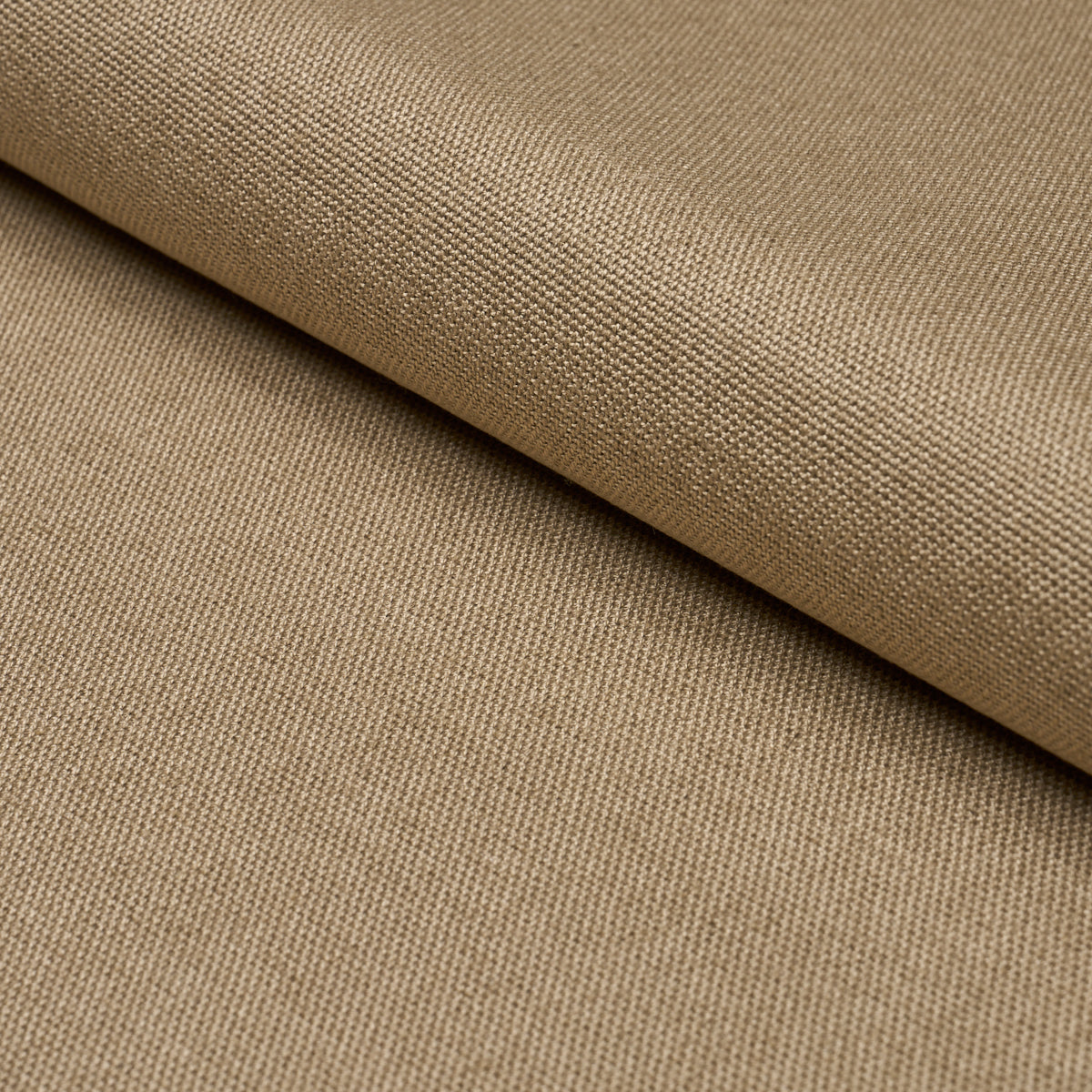 Driftwood-toned canvas fabric with a tight plain weave, folded edge, versatile upholstery or bag material.