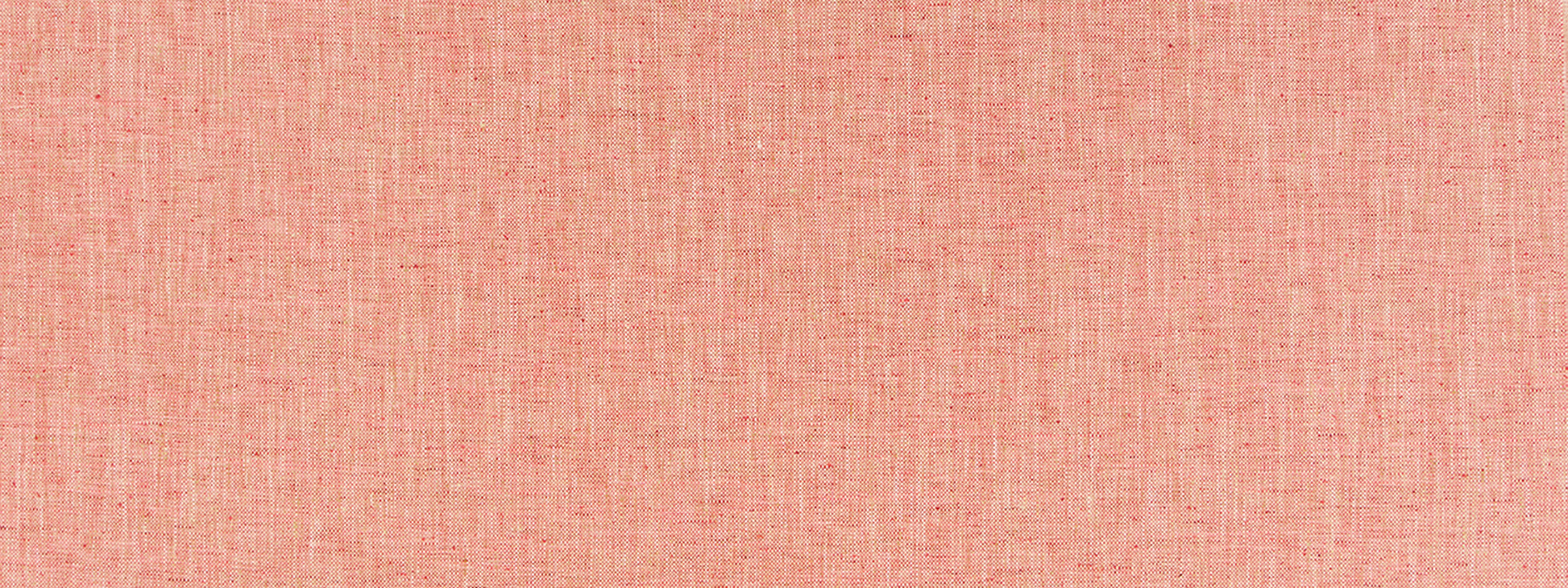 Peach pink woven fabric texture with visible weave; soft, breathable material for apparel or home decor.