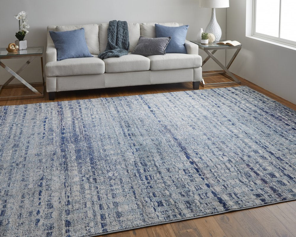 10' X 14' Blue And Ivory Abstract Power Loom Stain Resistant Area Rug