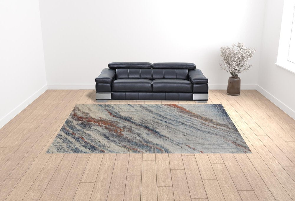 10' X 14' Ivory Orange And Blue Abstract Power Loom Stain Resistant Area Rug