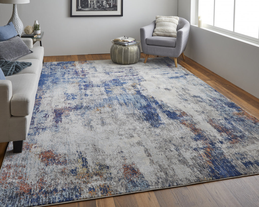 9' X 12' Ivory And Blue Abstract Power Loom Distressed Stain Resistant Area Rug