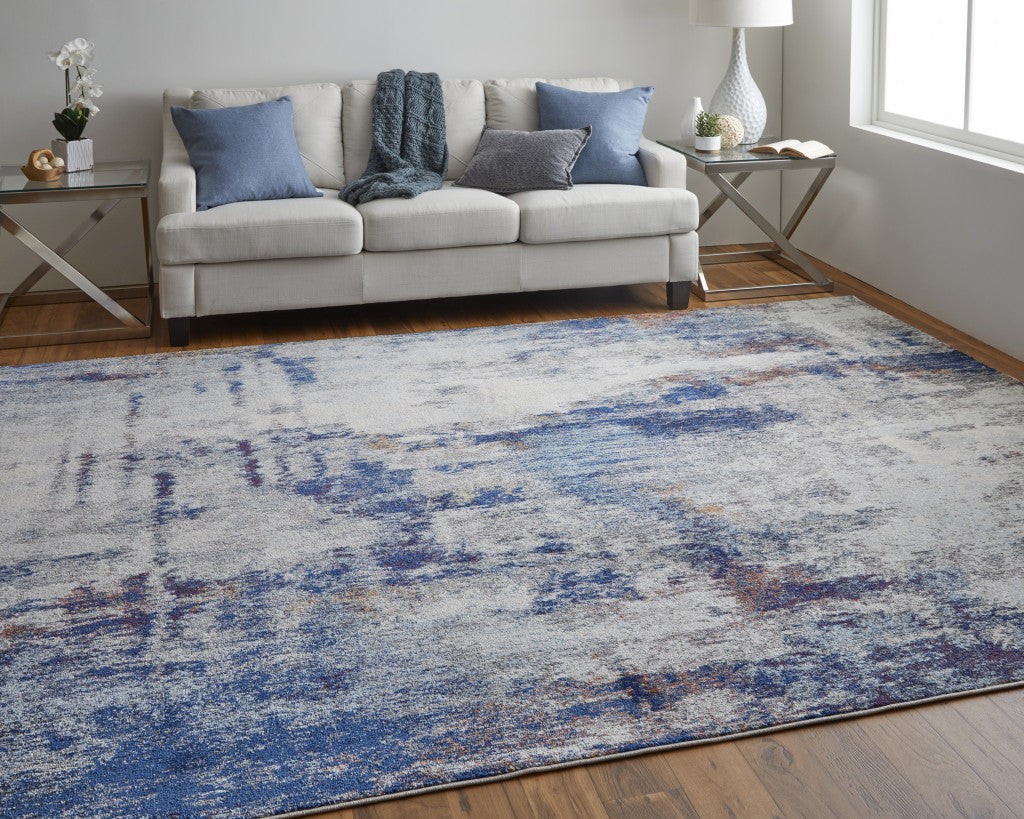 7' X 10' Ivory And Blue Abstract Power Loom Distressed Stain Resistant Area Rug