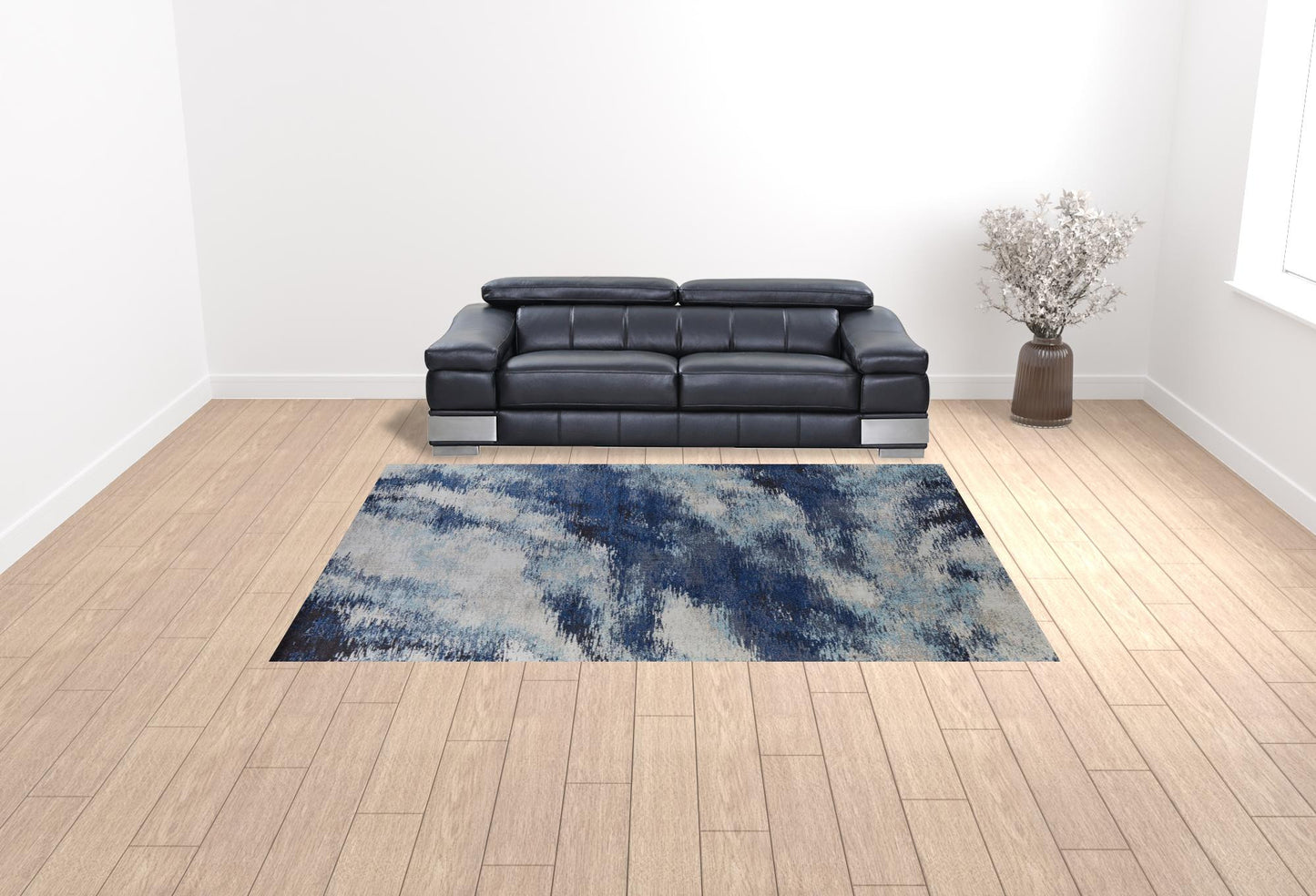 5' X 8' Blue And Ivory Abstract Power Loom Stain Resistant Area Rug