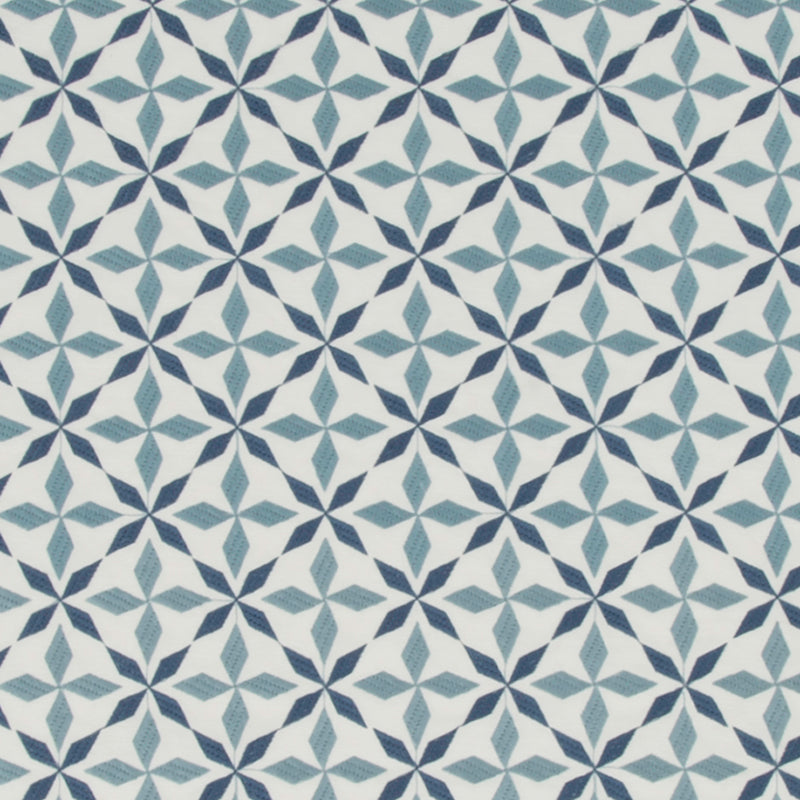 Blue geometric pattern with interlocking star shapes in navy and teal on chambray fabric.